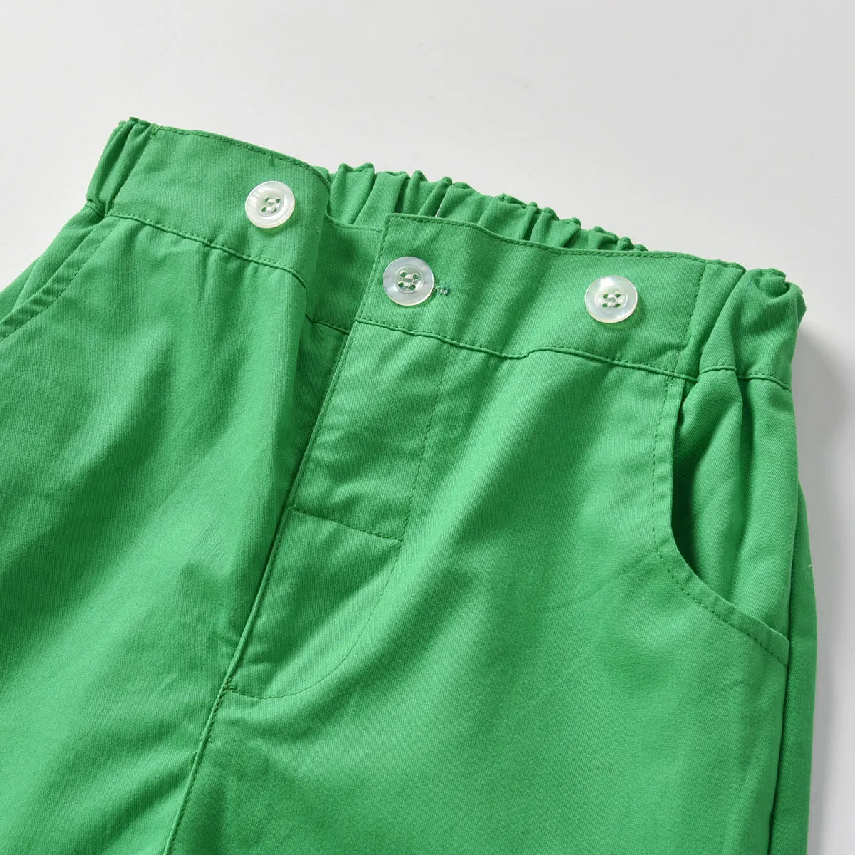 Boys green plaid long-sleeved shirt and overalls set on child model