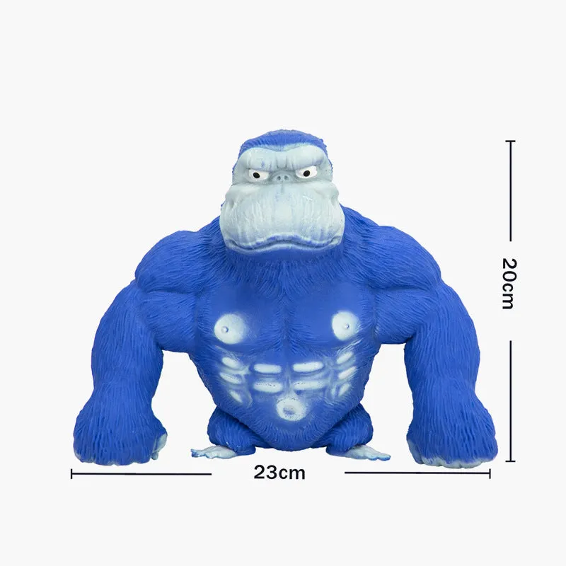 Yellow plastic orangutan decompression squeeze toy for stress relief on a plain background