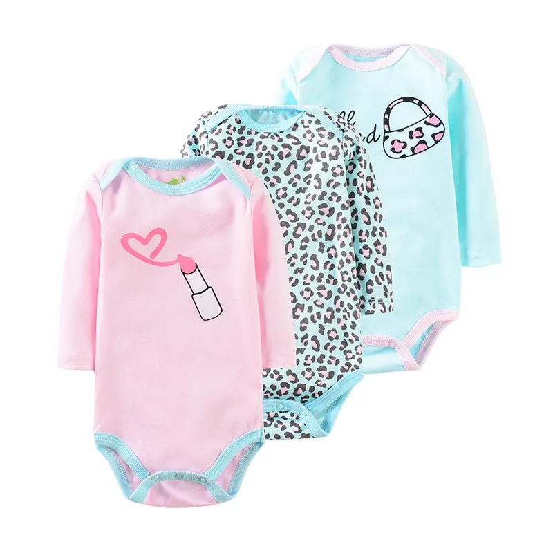 Three-piece baby romper set in 100% cotton, short climb style with concealed buttons, available in pink lipstick, pink elephant, and navy flower