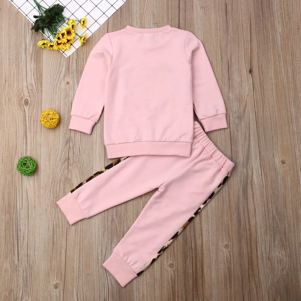 Children's pink cotton print sweatshirt and trousers two-piece set on white background