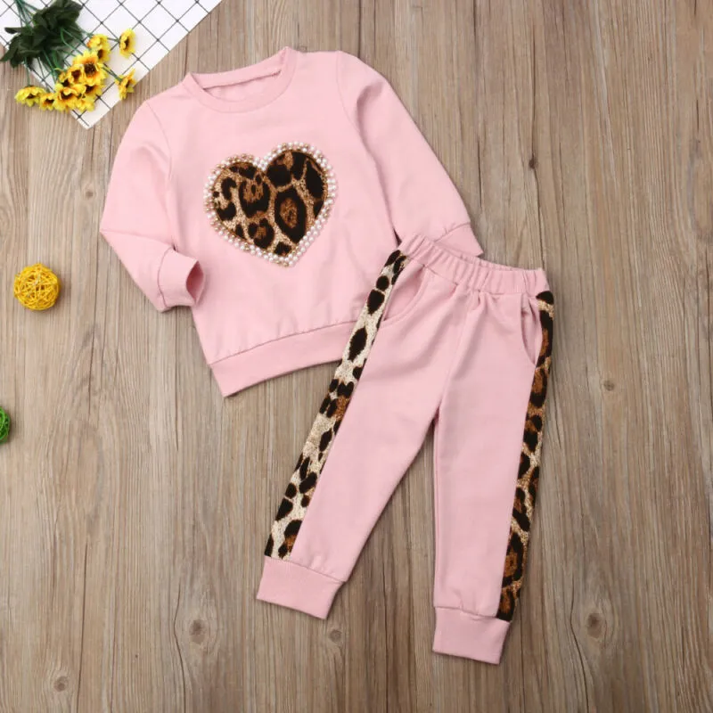 Children's pink cotton print sweatshirt and trousers two-piece set on white background