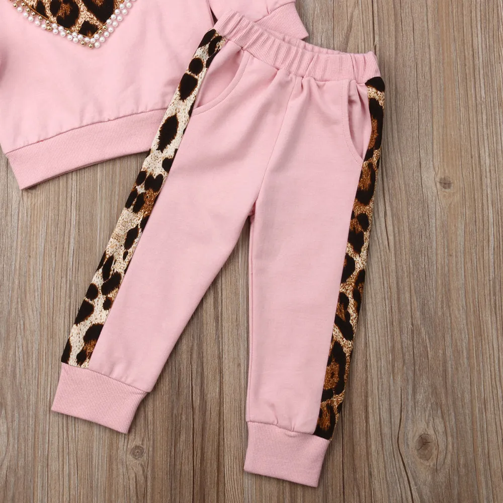 Children's pink cotton print sweatshirt and trousers two-piece set on white background