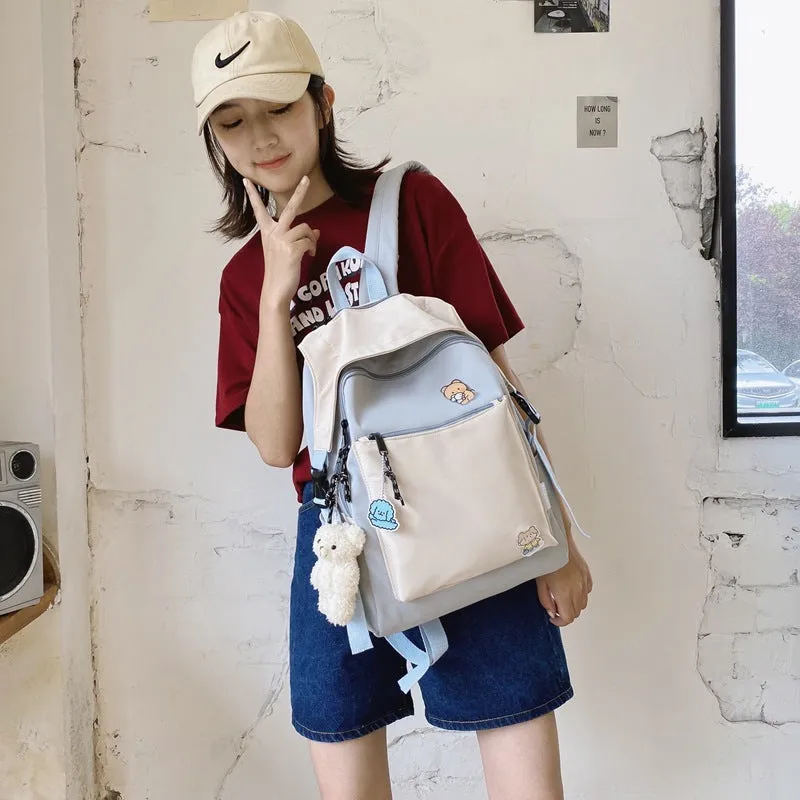 Korean style college backpack 20-35L water repellent in pink, front view