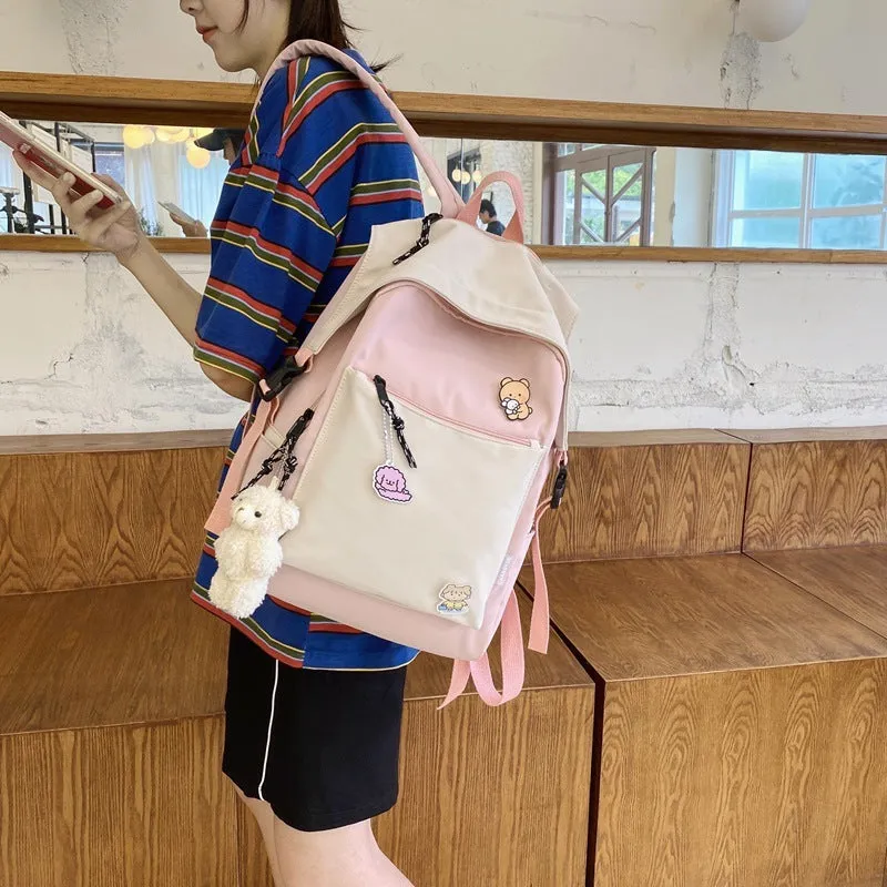 Korean style college backpack 20-35L water repellent in pink, front view