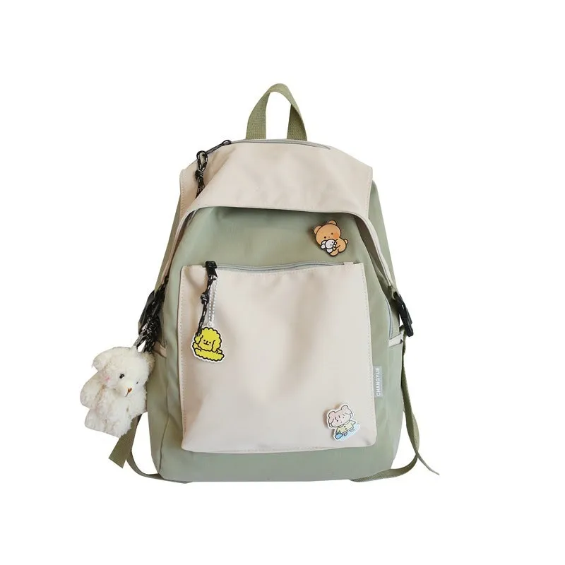 Korean style college backpack 20-35L water repellent in pink, front view
