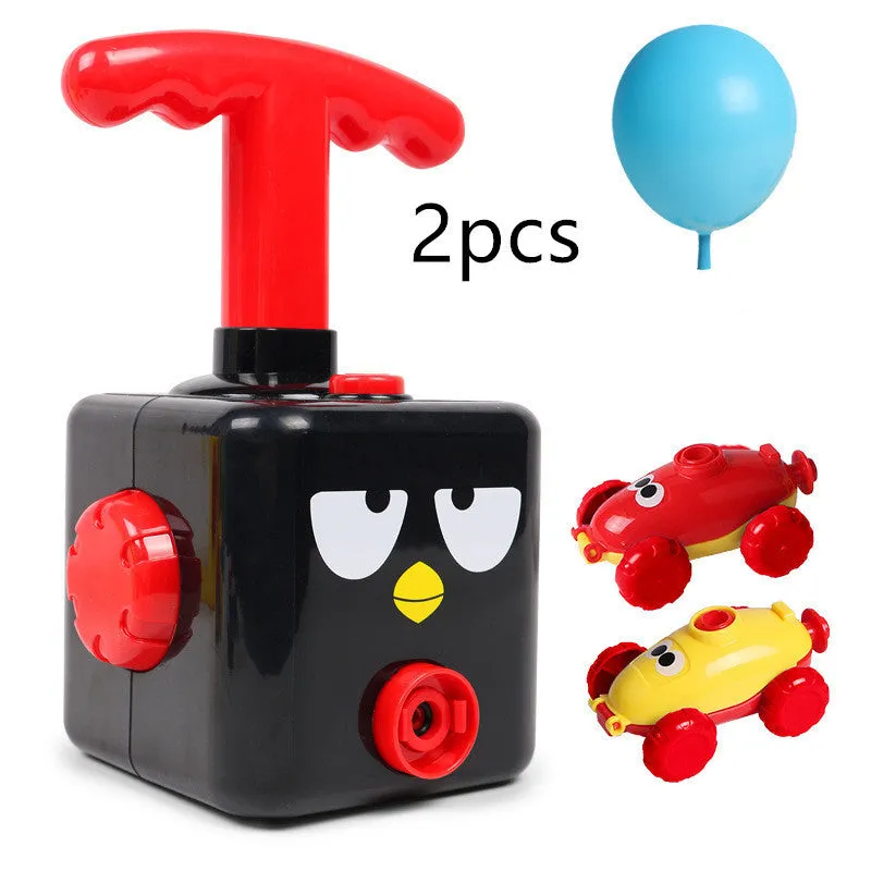 Balloon launch tower toy car with inflated balloon on a white surface