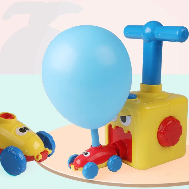 Balloon launch tower toy car with inflated balloon on a white surface