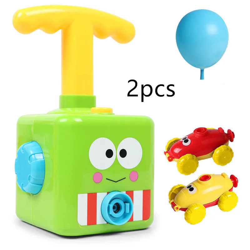 Balloon launch tower toy car with inflated balloon on a white surface