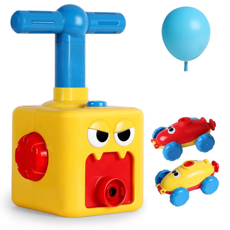 Balloon launch tower toy car with inflated balloon on a white surface