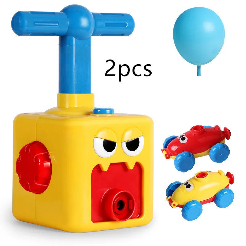 Balloon launch tower toy car with inflated balloon on a white surface