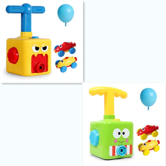 Balloon launch tower toy car with inflated balloon on a white surface