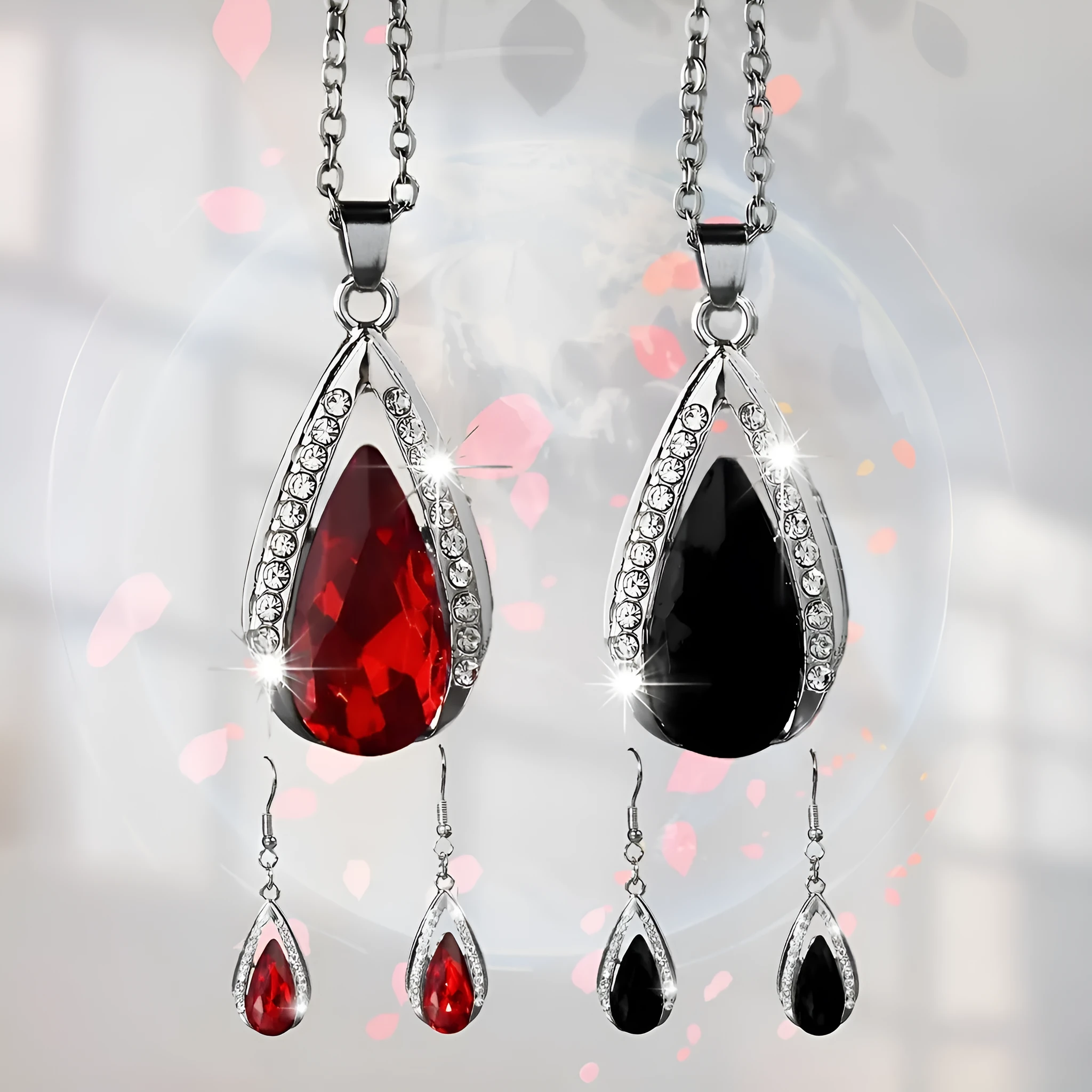 Teardrop pendant necklace and matching earrings jewellery suite in alloy with black or red glass accents