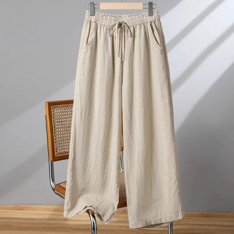 Women's straight-leg casual trousers in apricot colour with a drawstring elastic waistband and lace-up detail.