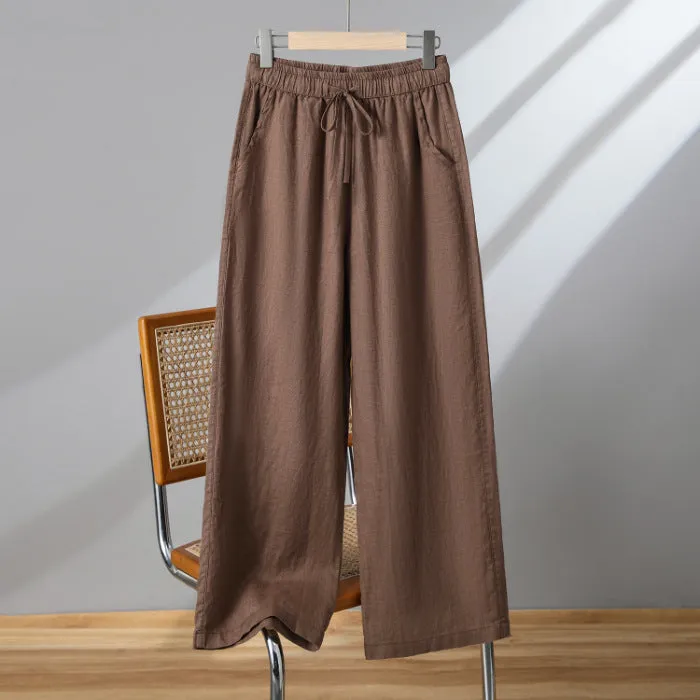 Women's straight-leg casual trousers in apricot colour with a drawstring elastic waistband and lace-up detail.