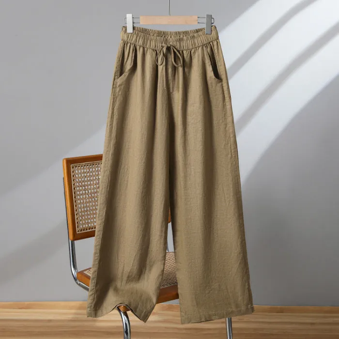 Women's straight-leg casual trousers in apricot colour with a drawstring elastic waistband and lace-up detail.