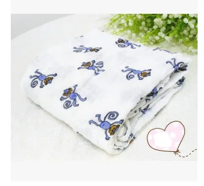Cotton gauze baby blanket 120x120cm in balloon elephant style folded on a light background