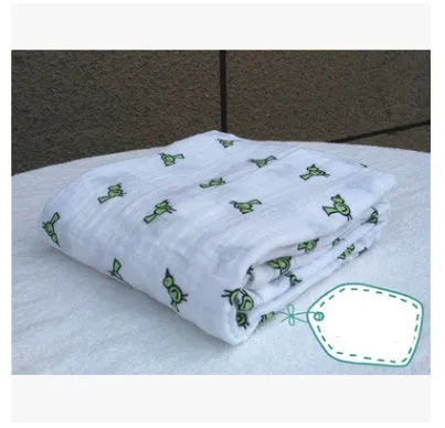 Cotton gauze baby blanket 120x120cm in balloon elephant style folded on a light background