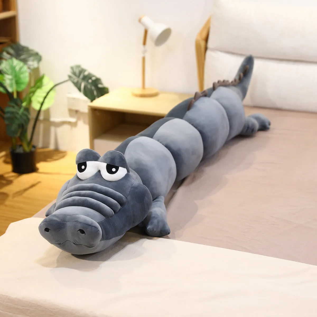 Symphony soft velvet alligator plush toy in green colour on a plain background