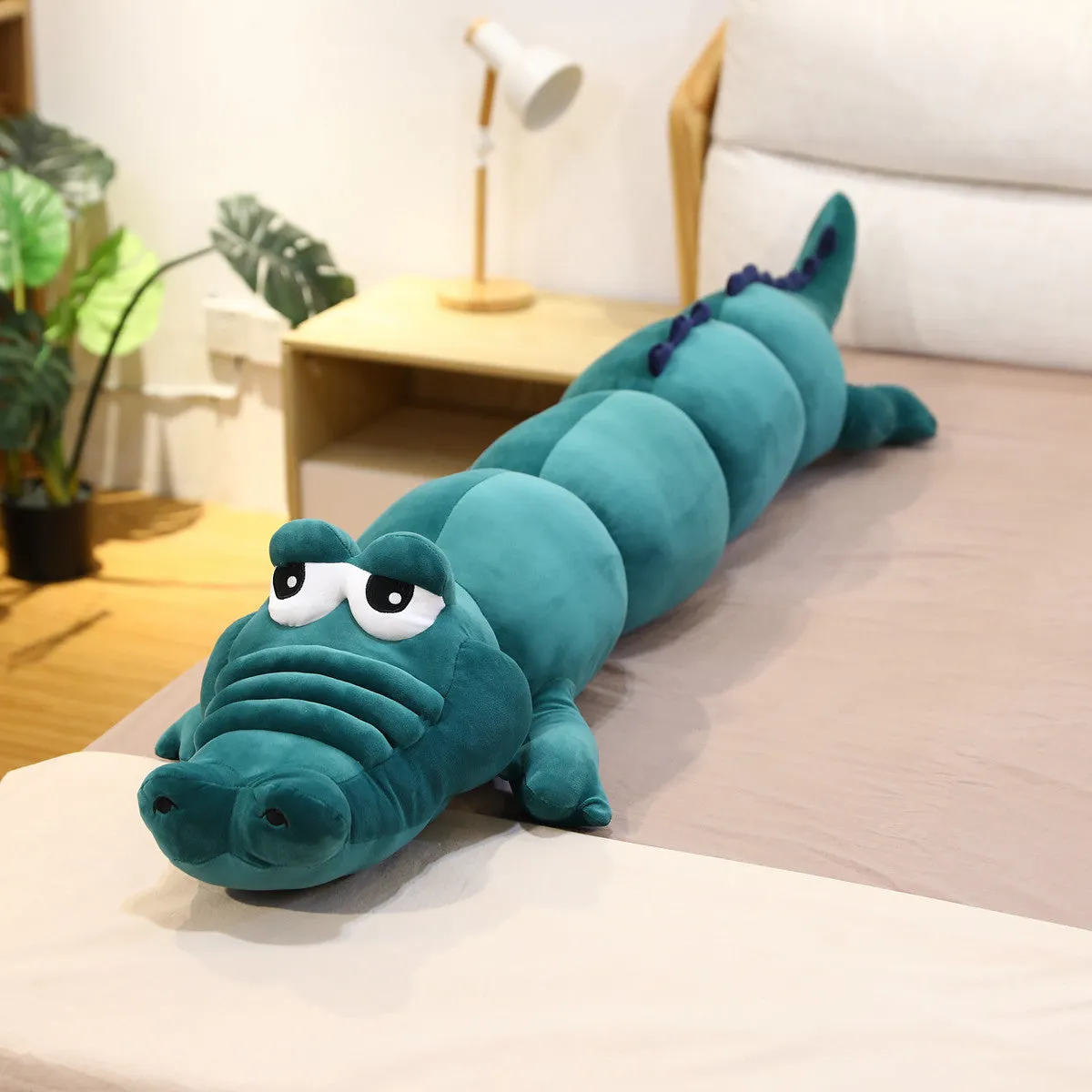 Symphony soft velvet alligator plush toy in green colour on a plain background