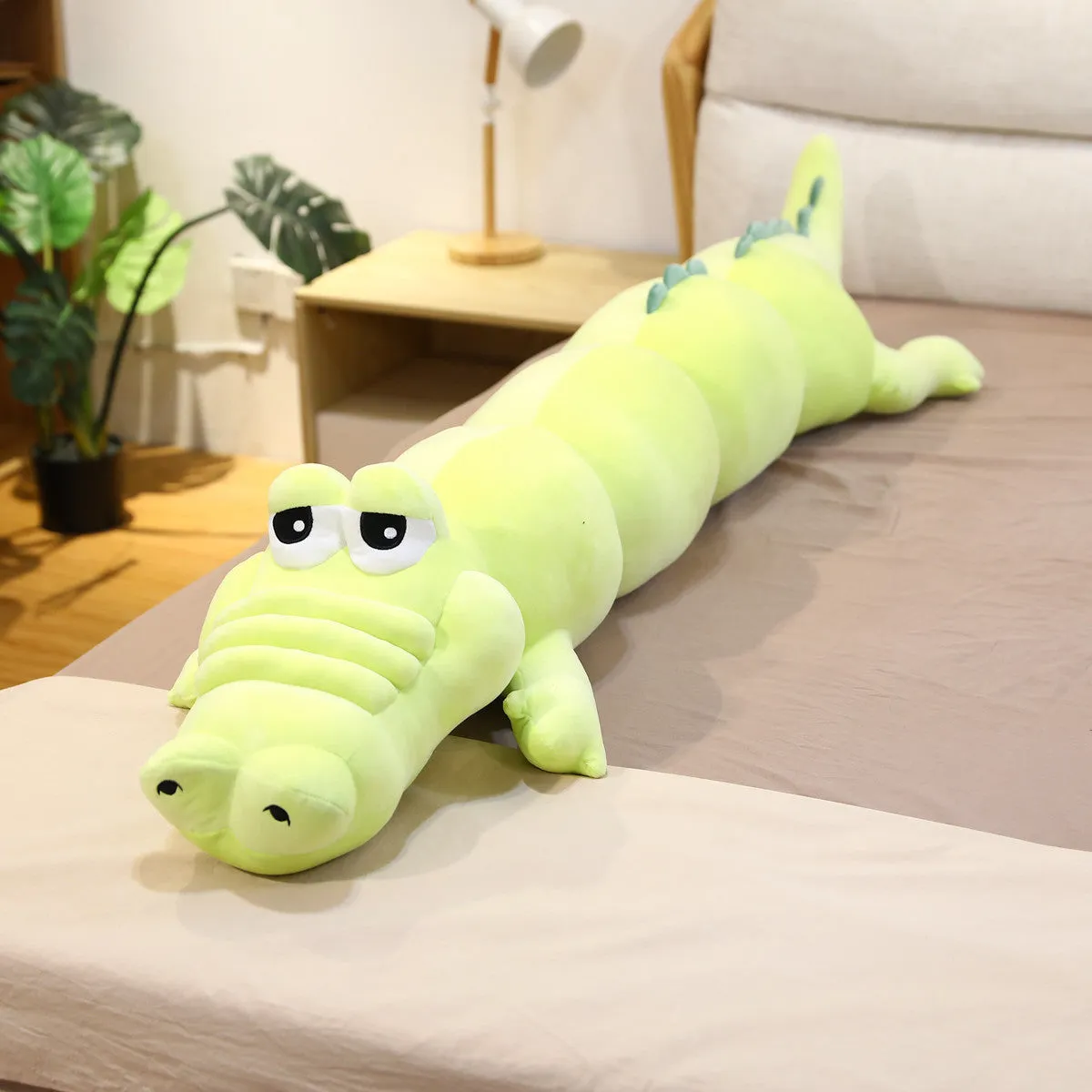 Symphony soft velvet alligator plush toy in green colour on a plain background