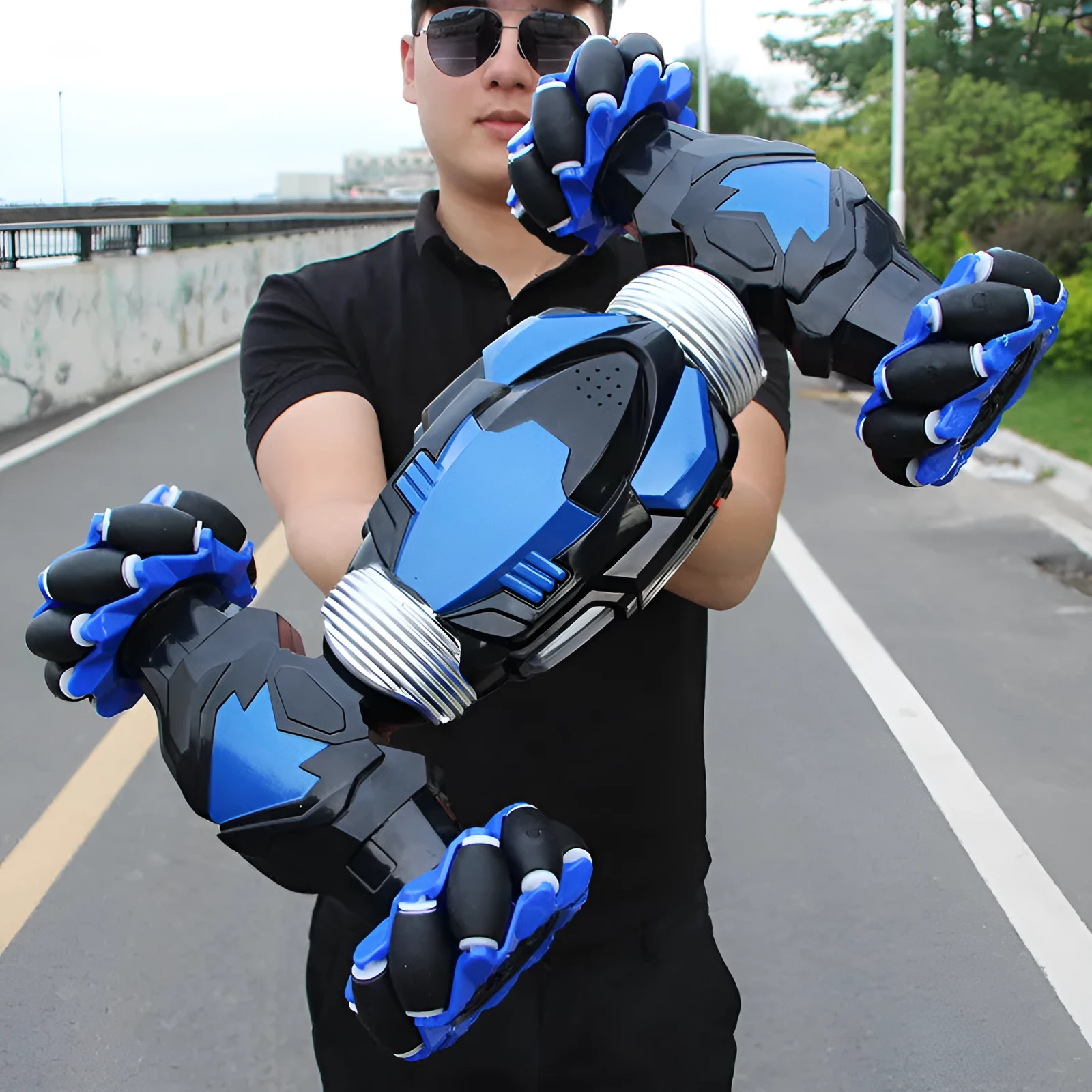 Blue electric remote control car with two motors, ABS plastic body, climbing and twisting wheels, on a pavement surface