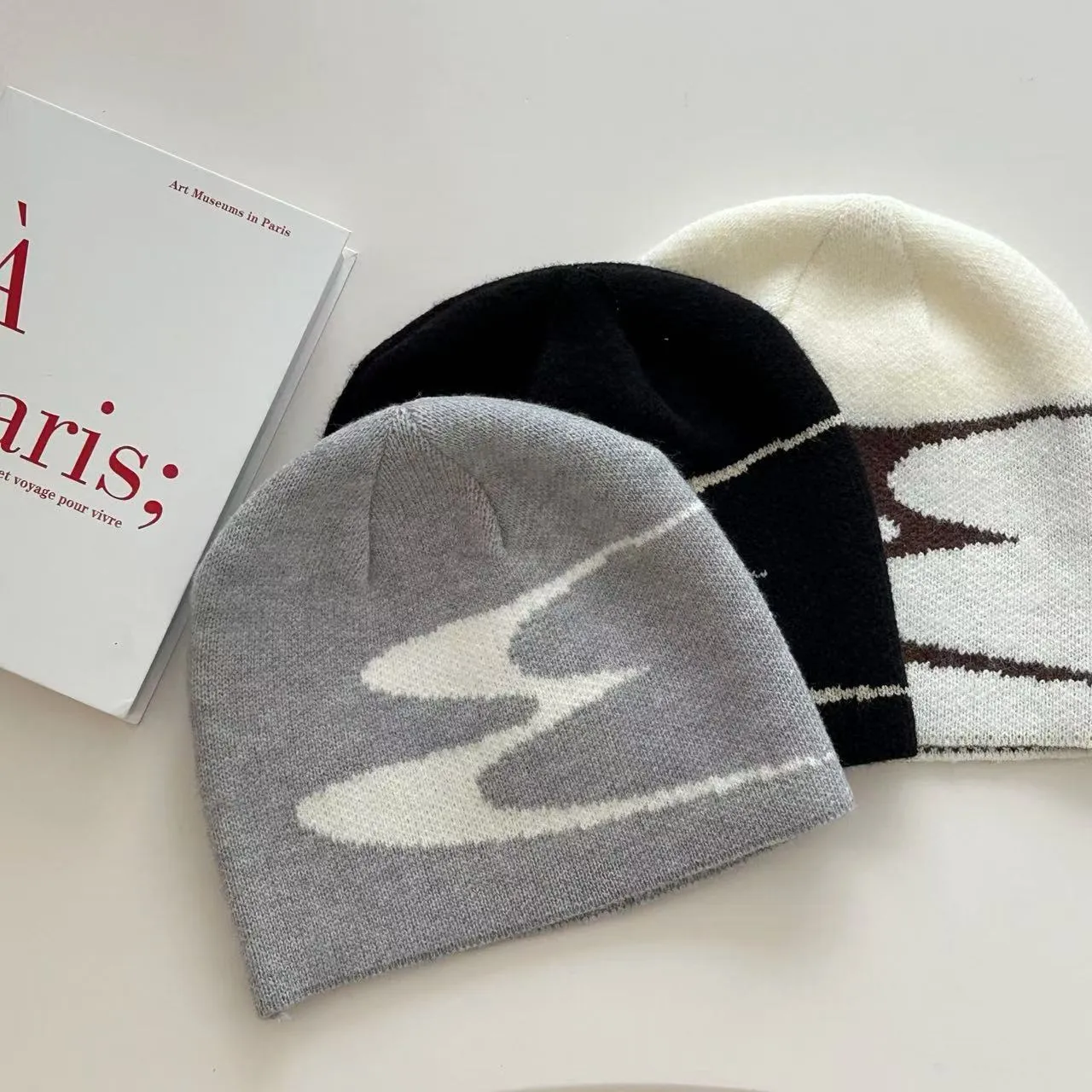 Acrylic knitted beanie hat in black, grey, or white for men and women with 56-58cm size