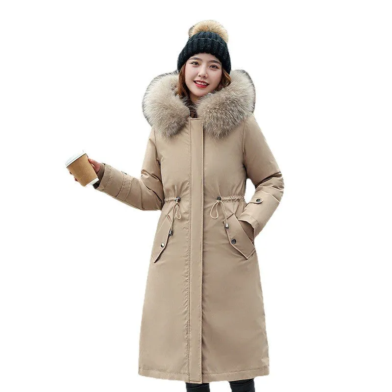 Women's long beige fleece trench coat with two-way zip, shown on a model.