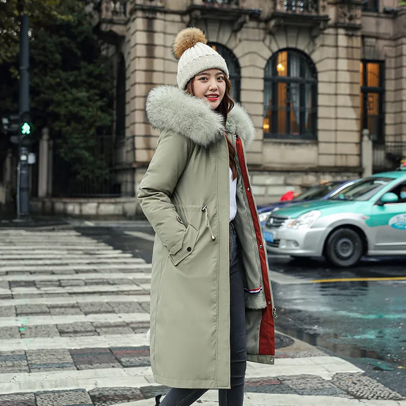 Women's long beige fleece trench coat with two-way zip, shown on a model.