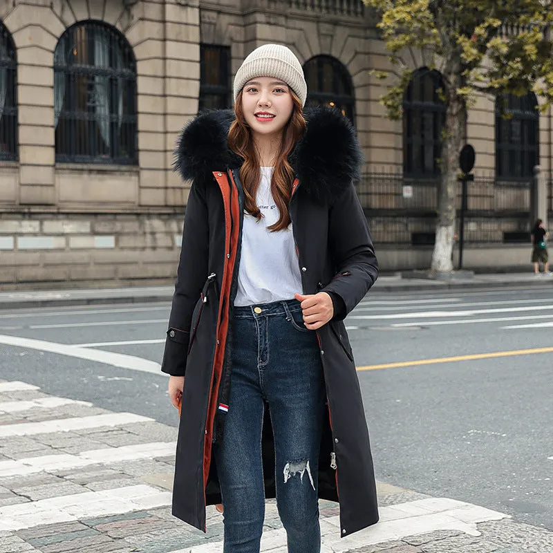 Women's long beige fleece trench coat with two-way zip, shown on a model.