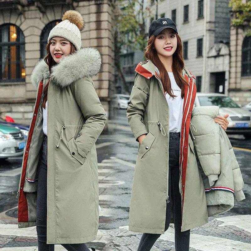 Women's long beige fleece trench coat with two-way zip, shown on a model.