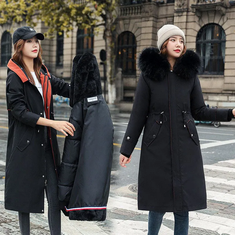 Women's long beige fleece trench coat with two-way zip, shown on a model.