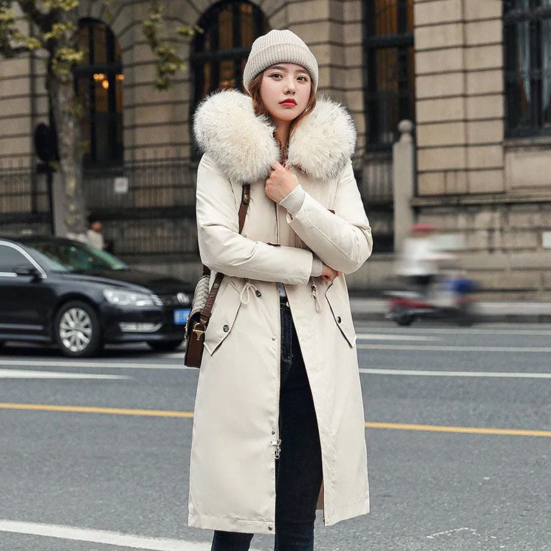 Women's long beige fleece trench coat with two-way zip, shown on a model.
