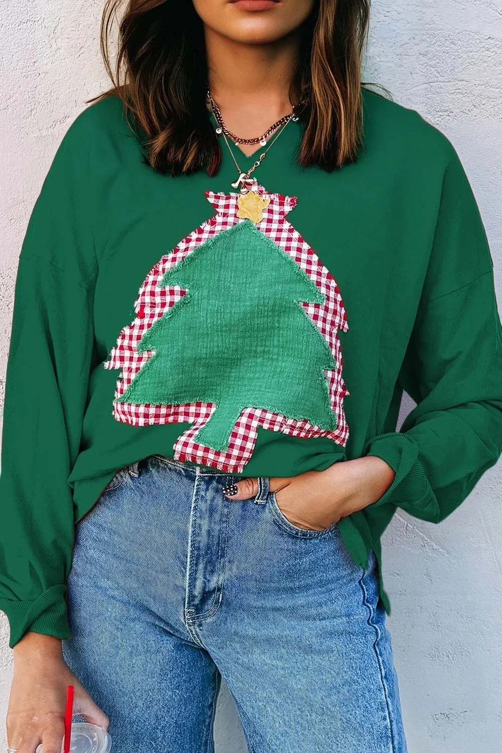 Women's Christmas Tree Patch Off-shoulder Sweater in evergreen with sequin tree detail, long sleeves, loose fit