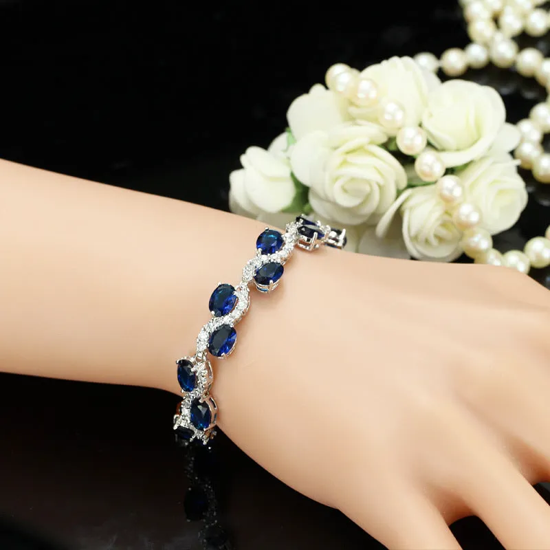 Geometric gold electroplated women's bracelet with inlaid AAA+ zircon stones on a copper base.