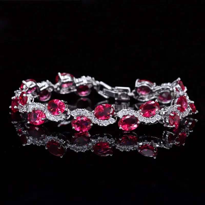 Geometric gold electroplated women's bracelet with inlaid AAA+ zircon stones on a copper base.