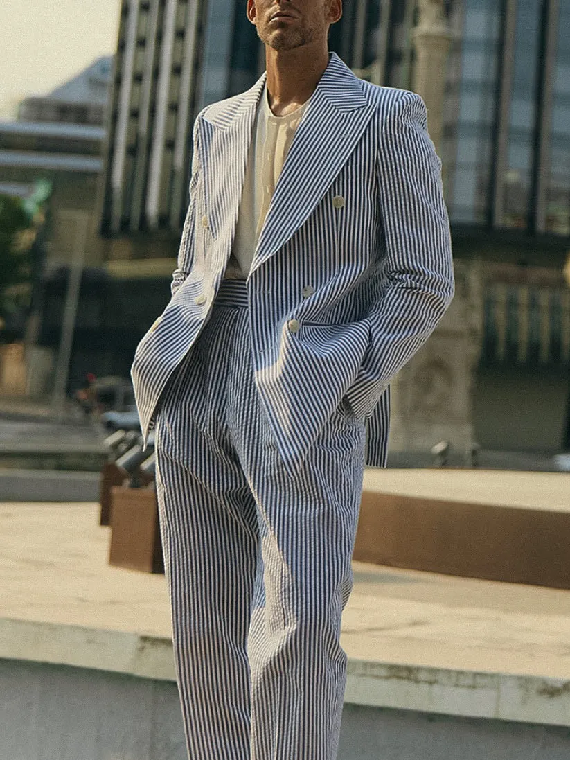 Blue and white striped women's blazer and trouser suit set on a hanger