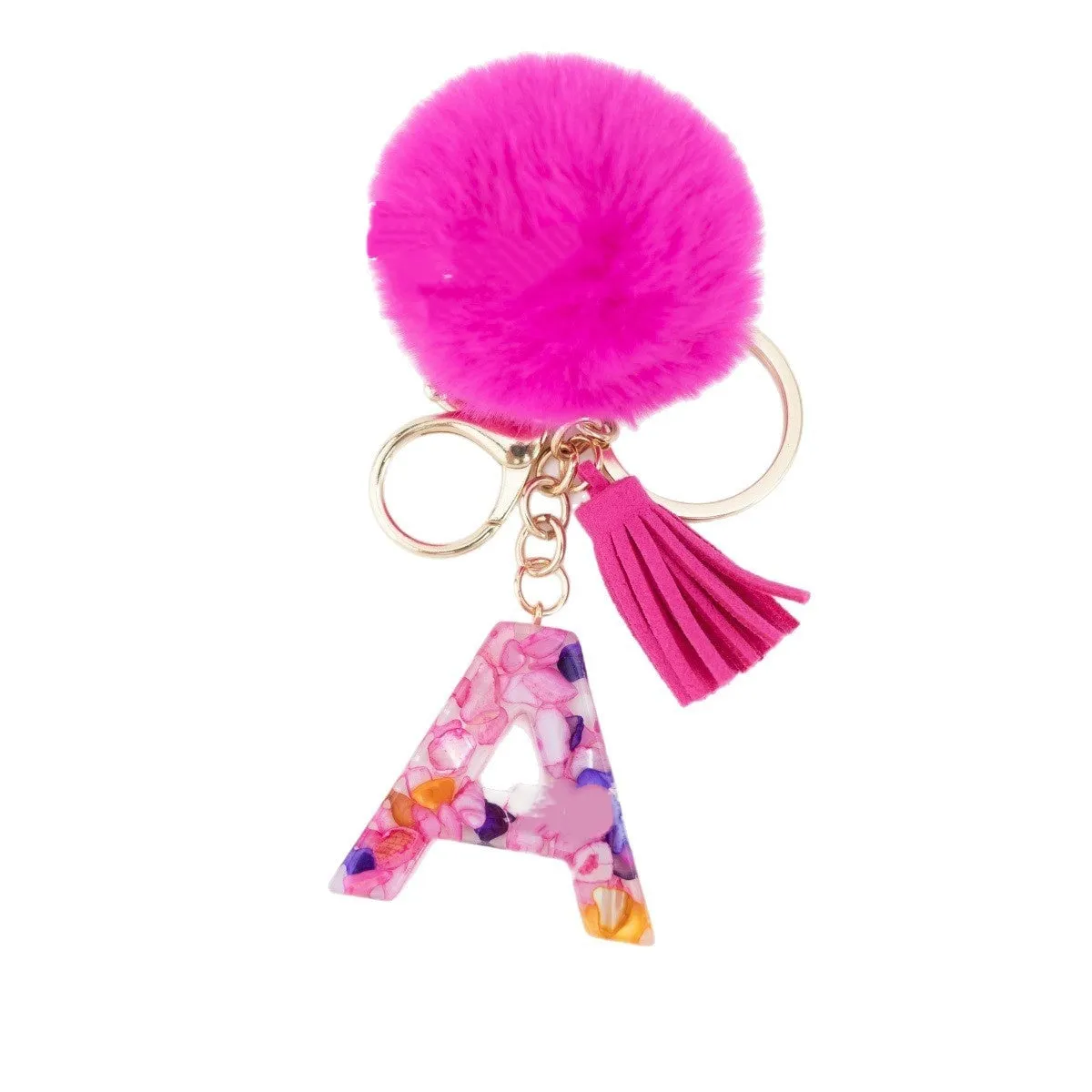 Rose red stone keychain with English letter B, fur ball and tassel on a white background