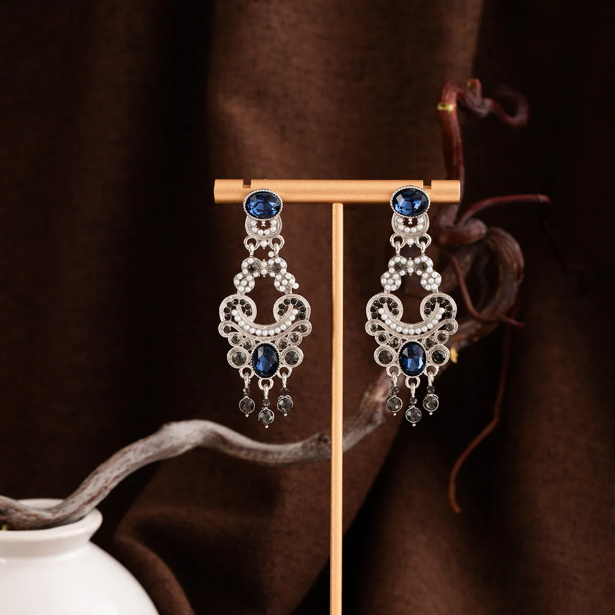 Vintage court style earrings with atmospheric blue crystal and chamfered square grain geometric shape in E7744 colour
