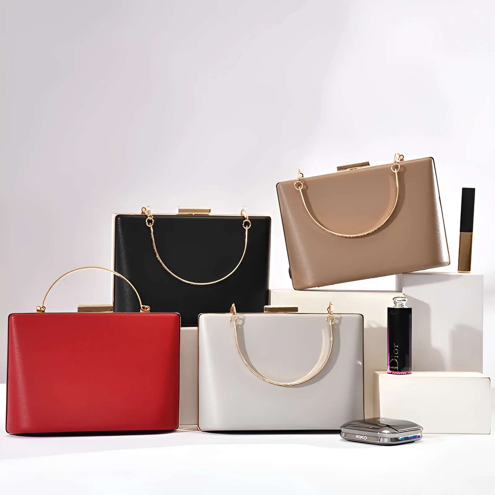 Solid colour PU leather crossbody bag in pillow shape with double-ring detail, 18.5x13.5x7cm, in black.