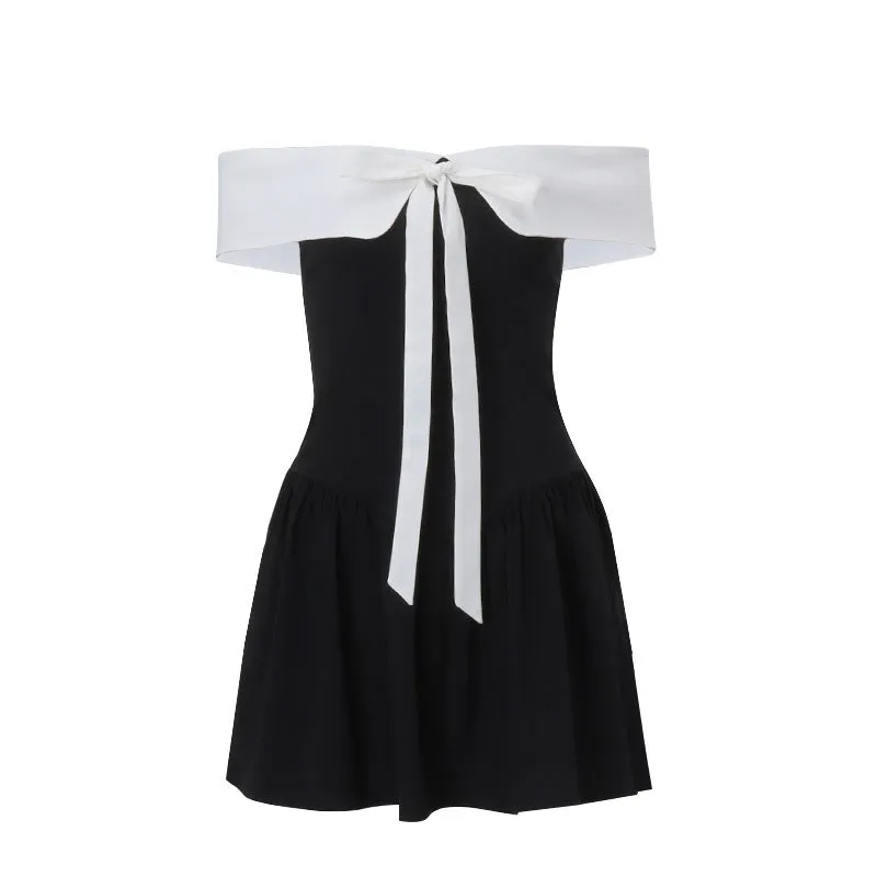 Black off-shoulder lace-up waist trimming short-sleeved A-line dress with bow and contrast stitching on a model