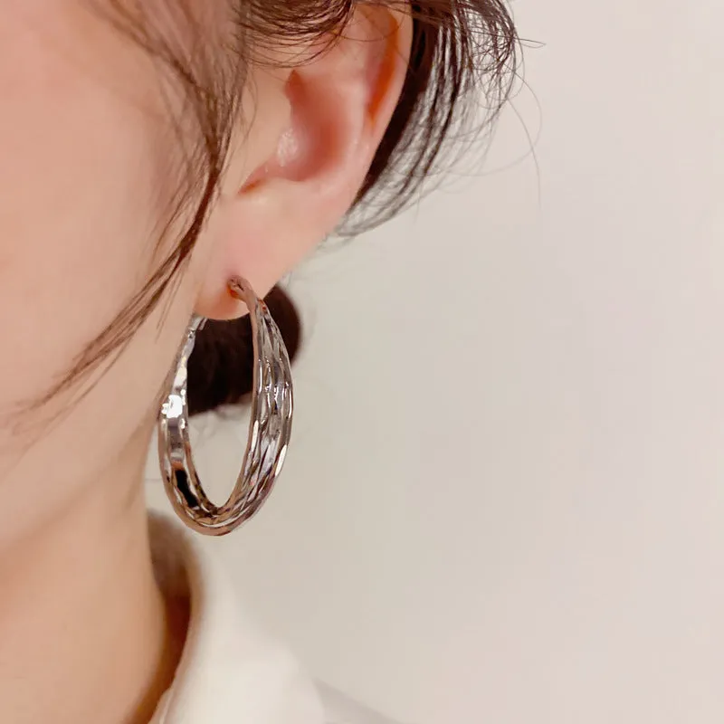 Silver Needle fashion simple metal twisted earrings in gold electroplated finish on copper base, round geometric shape