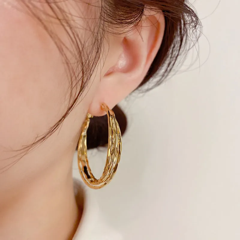 Silver Needle fashion simple metal twisted earrings in gold electroplated finish on copper base, round geometric shape