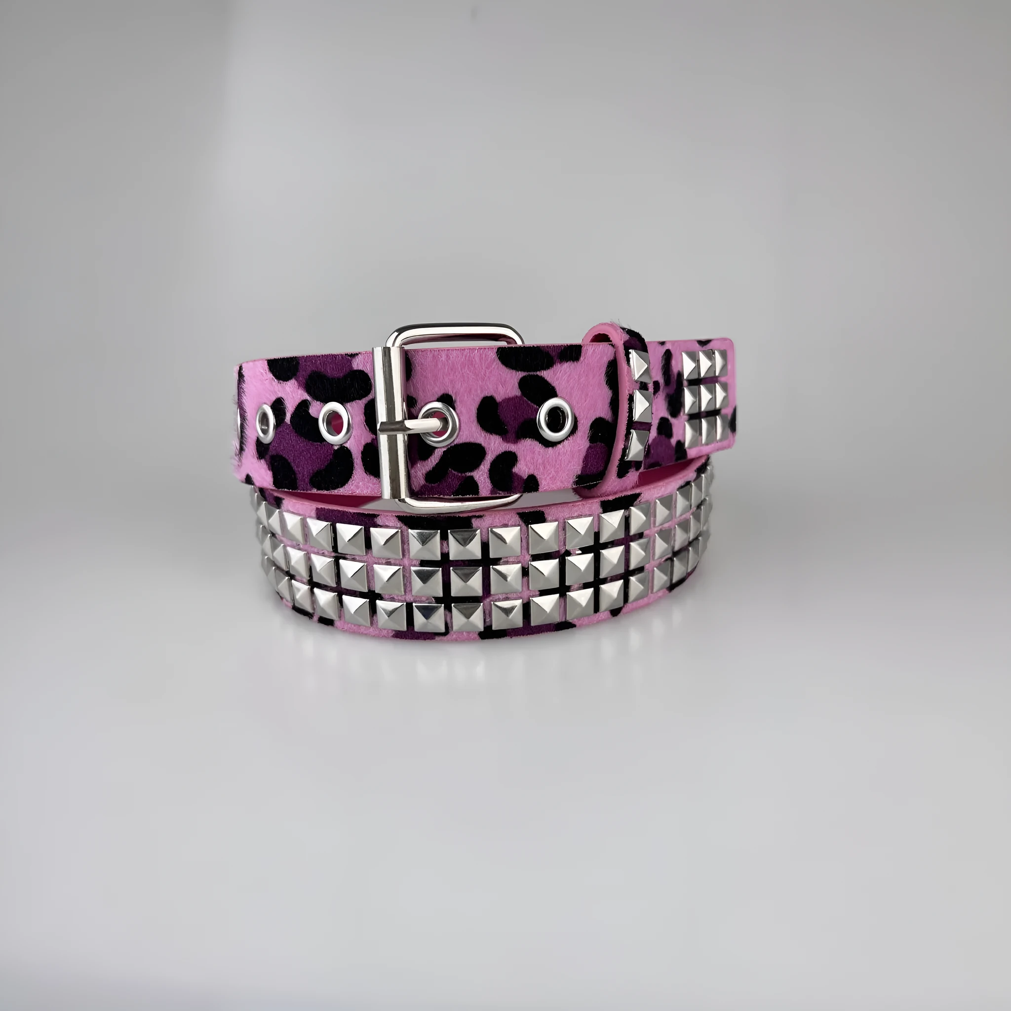 Women's punk style belt with decorative metal rivets on PU leather in animal print pattern with alloy buckle