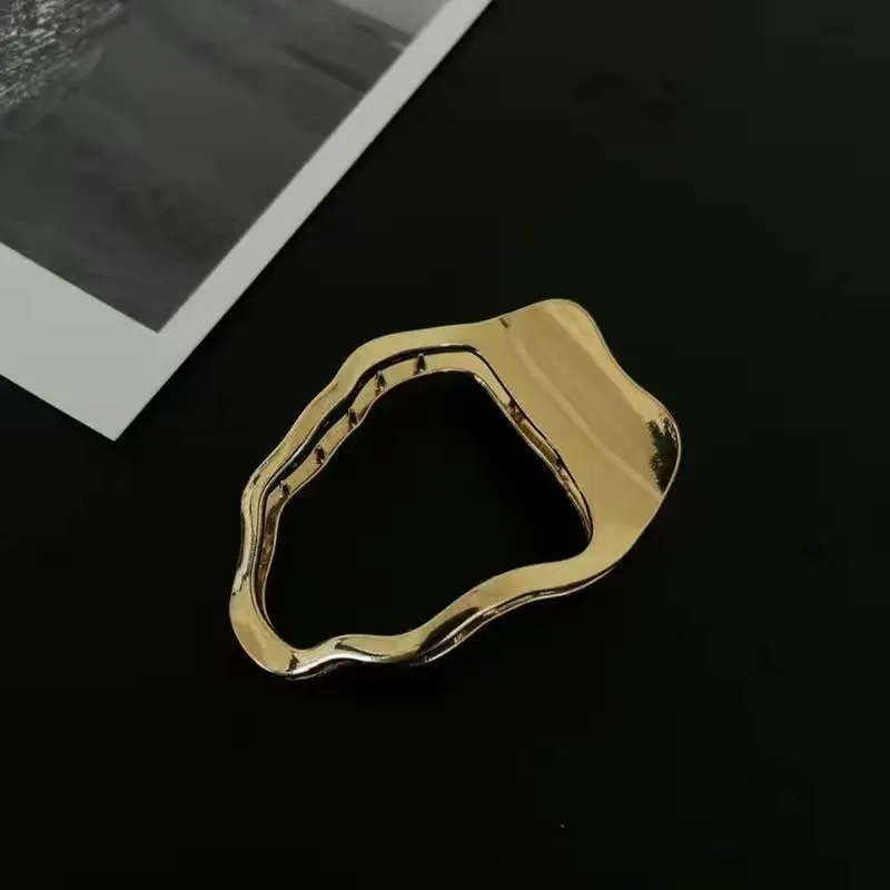 Women's zinc alloy hair barrette in gold colour with triangle shape