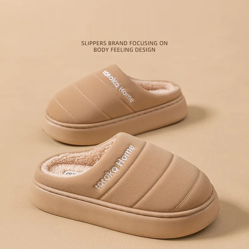Pair of khaki fleece-lined cotton slippers with round toe and flat platform sole