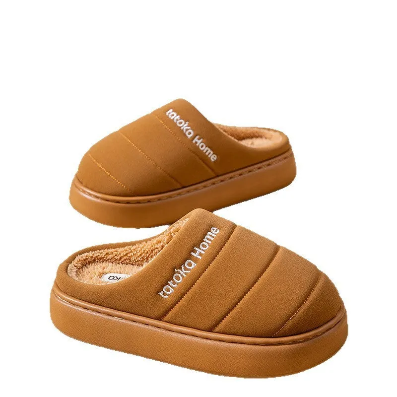 Pair of khaki fleece-lined cotton slippers with round toe and flat platform sole