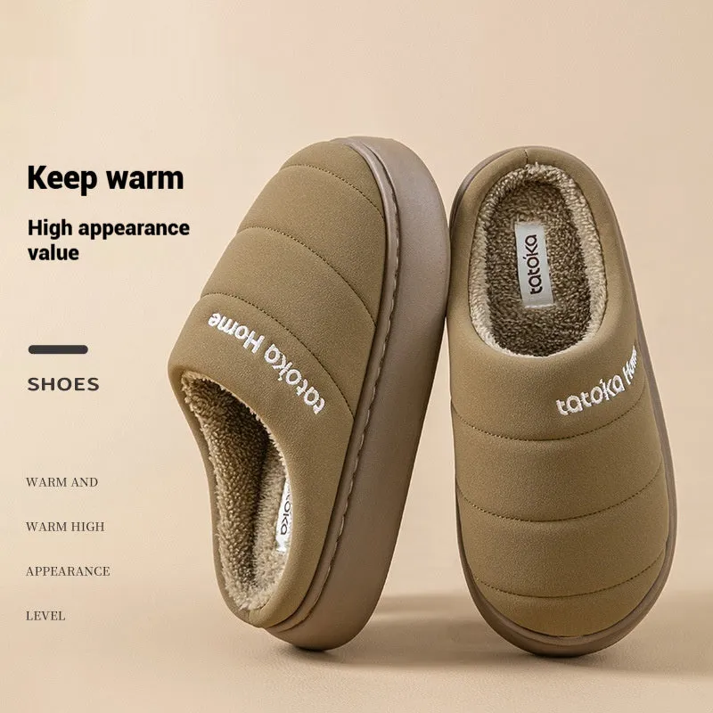 Pair of khaki fleece-lined cotton slippers with round toe and flat platform sole