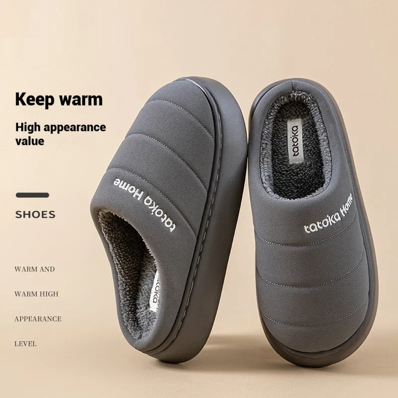 Pair of khaki fleece-lined cotton slippers with round toe and flat platform sole
