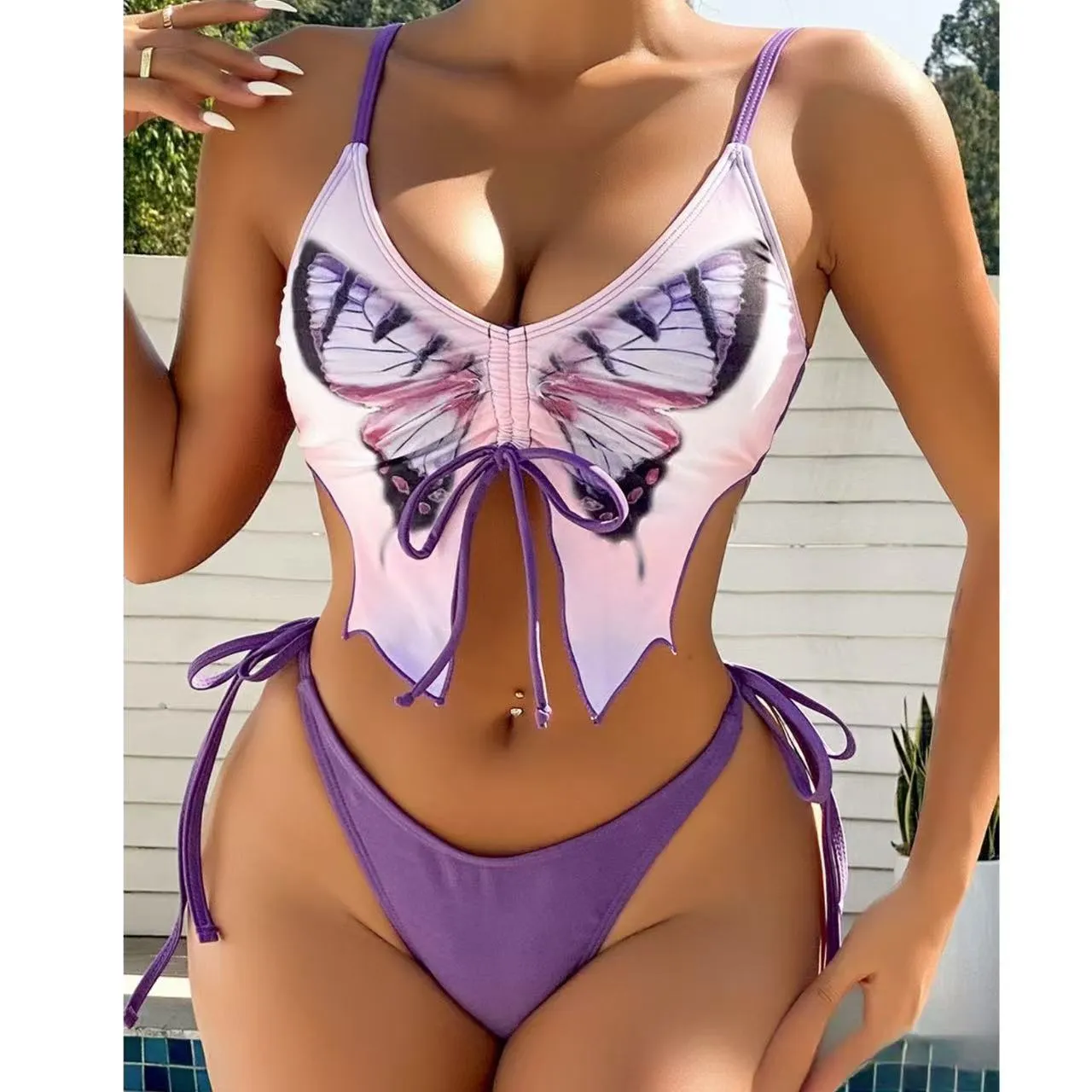 Women's purple bow ins style split bikini suit top and briefs on a mannequin.