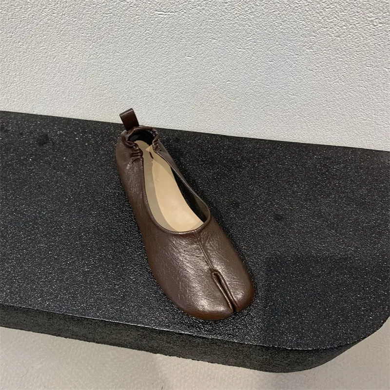 Women's apricot coloured chunky heel pumps with split toe horseshoe detail and round toe.